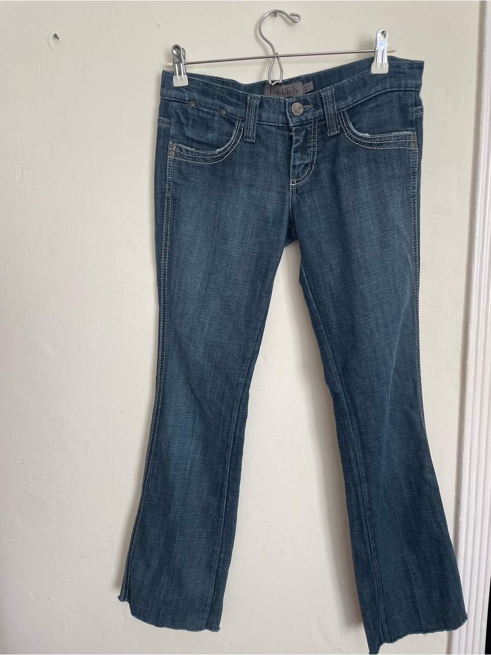 Frankie B. Medium Dark Blue Flare Jeans with Stud Details on back pockets.